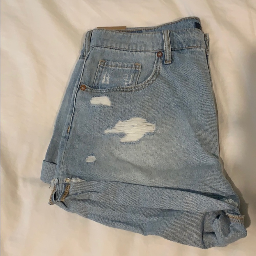 Brand new light wash jean shorts with rips